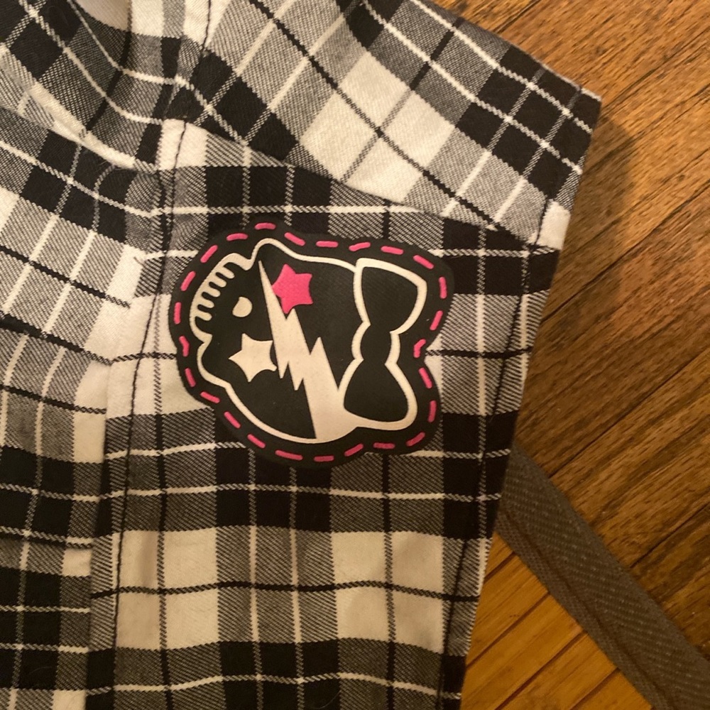 Punk rock black and white checkered plaid shirt w/ skull. Black buckles on side